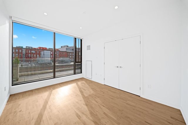 a view of entryway with wooden floor
