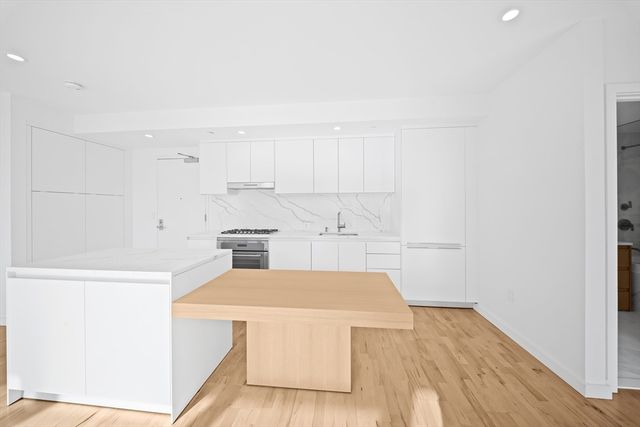 a view of a kitchen with wooden floor