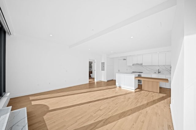 a bedroom with a bed and a cabinets