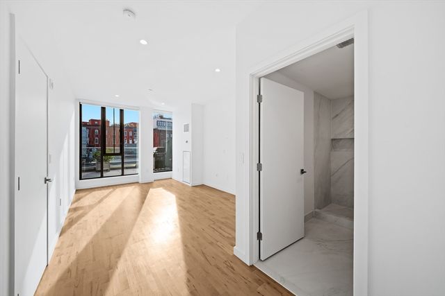 a view of a bathroom with a tub and shower