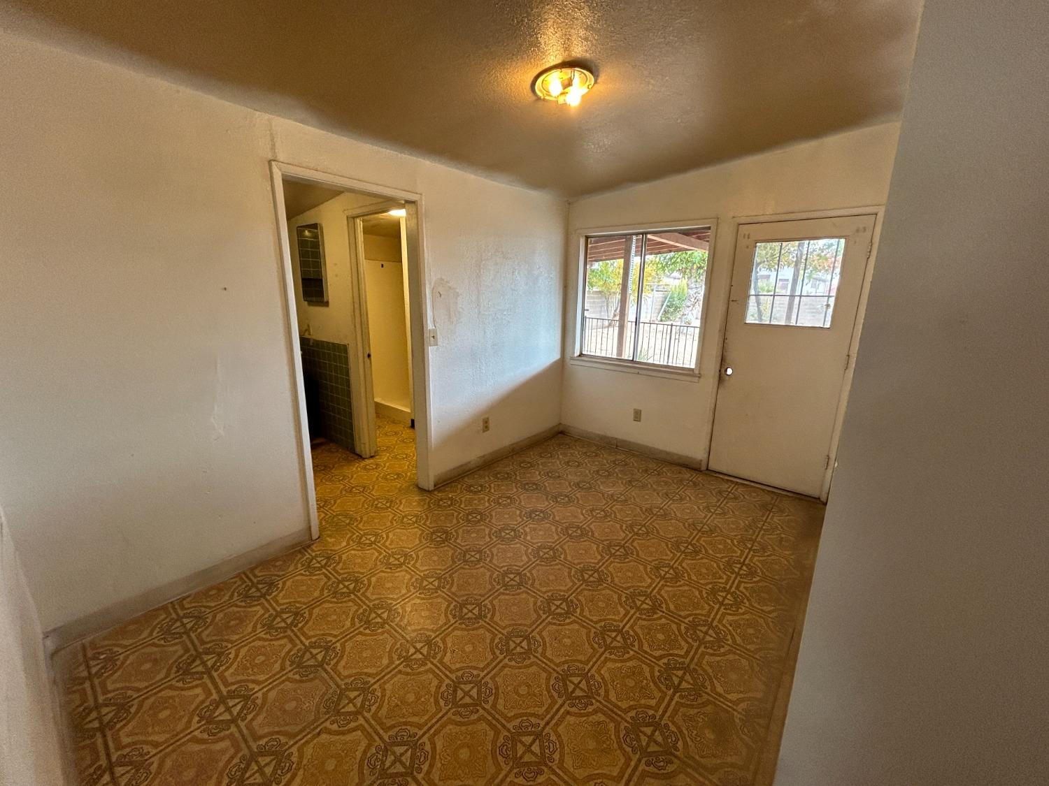 236 K Street Sanger, CA 93657 - Photo 15 of 23 en empty room with windows