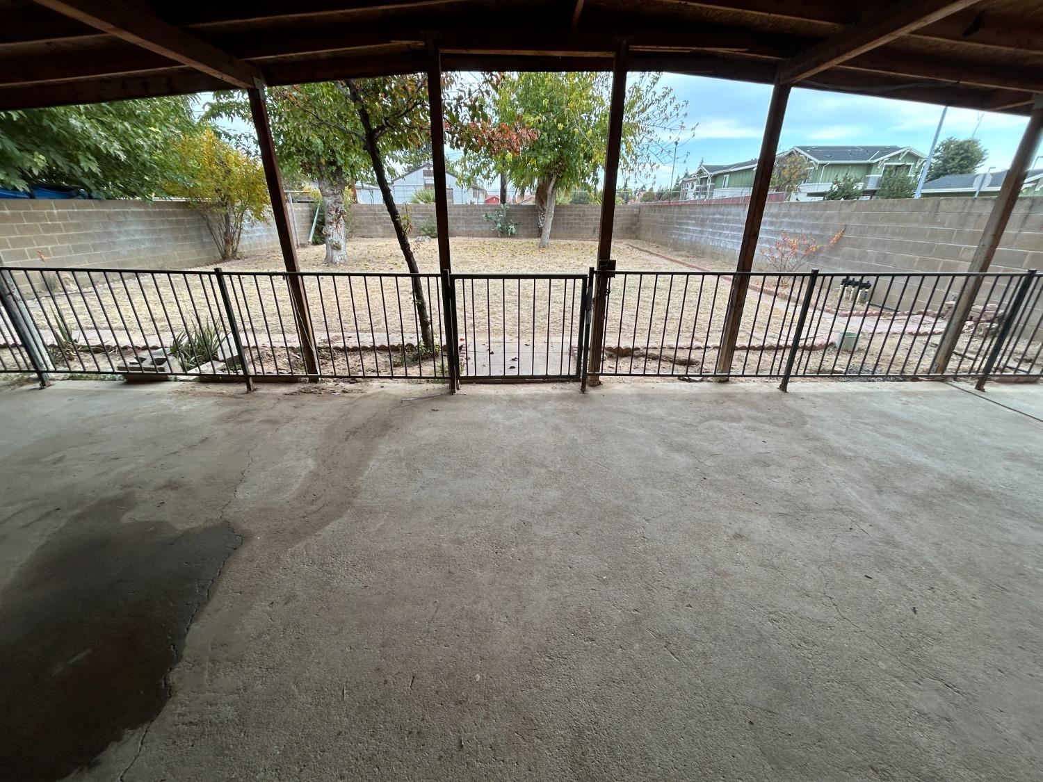 236 K Street Sanger, CA 93657 - Photo 19 of 23 an empty room with wooden floor and yard