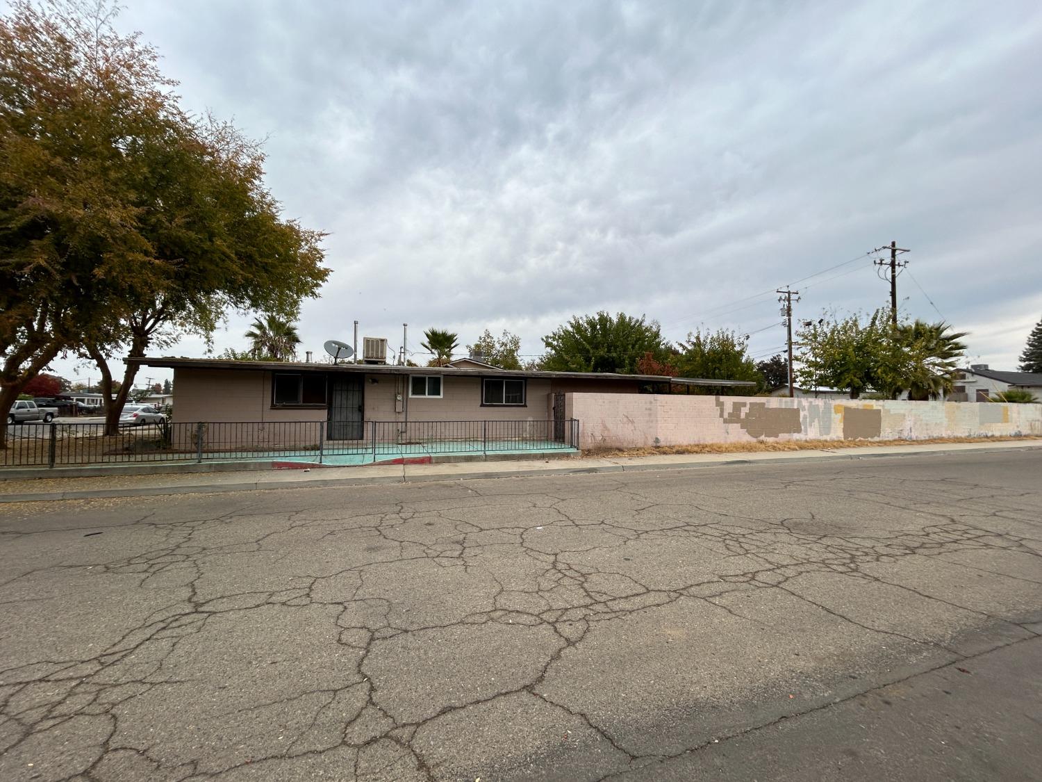 236 K Street Sanger, CA 93657 - Photo 23 of 23 a view of a yard with a large tree