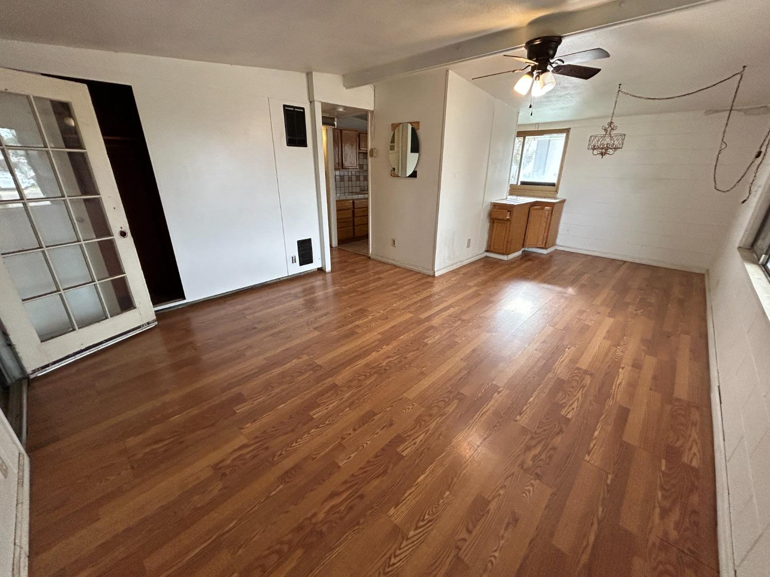 236 K Street Sanger, CA 93657 - Photo 5 of 23 a view of a livingroom with wooden floor and staircase