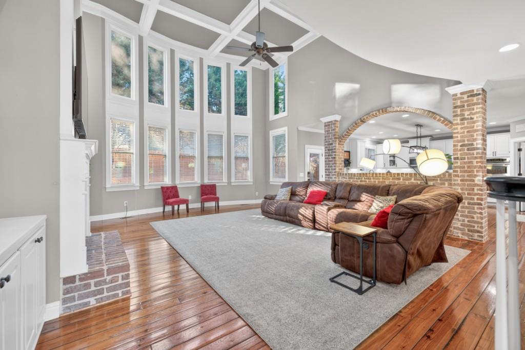 8023 Sleepy Lagoon Way Flowery Branch, GA 30542 - Photo 11 of 79 a living room filled with furniture and a large window