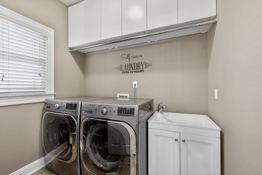 8023 Sleepy Lagoon Way Flowery Branch, GA 30542 - Photo 21 of 79 a utility room with dryer and washer