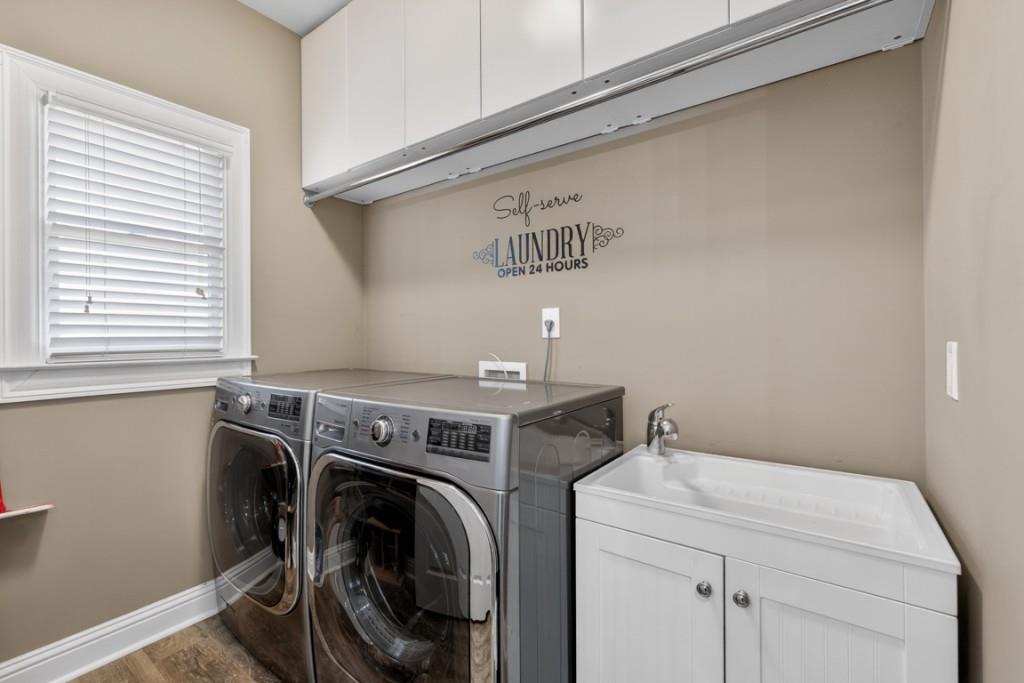 8023 Sleepy Lagoon Way Flowery Branch, GA 30542 - Photo 22 of 79 a utility room with dryer and washer