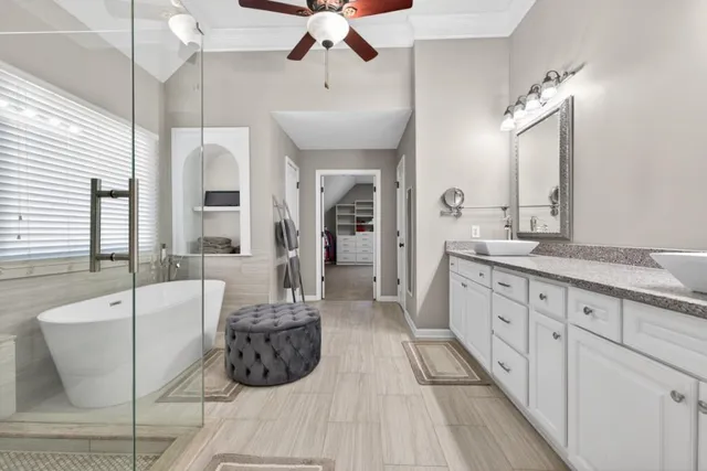 an aerial view of house with yard and mountain view in back