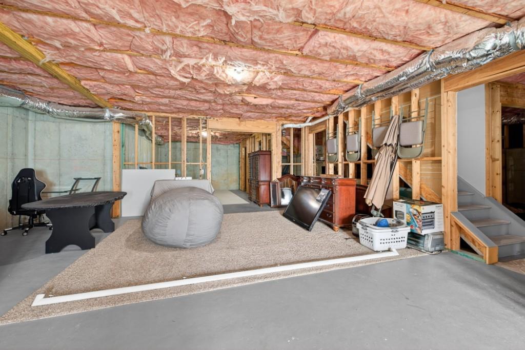 8023 Sleepy Lagoon Way Flowery Branch, GA 30542 - Photo 47 of 79 a room with gym equipment and large mirror