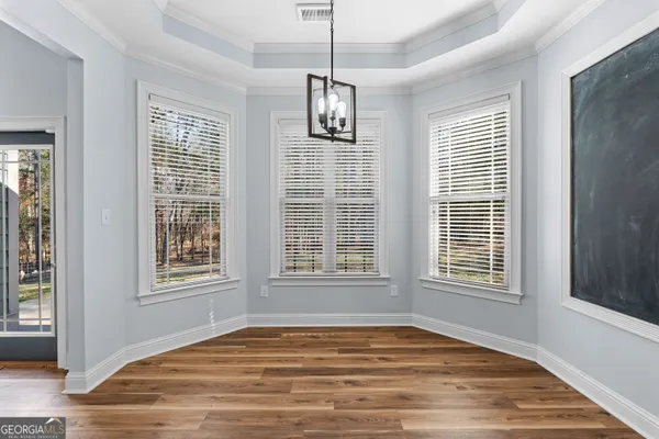 a view of a kitchen with wooden floor