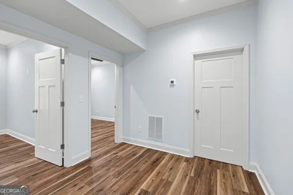 a view of a livingroom with wooden floor