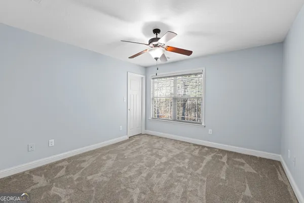a view of hallway with wooden floor