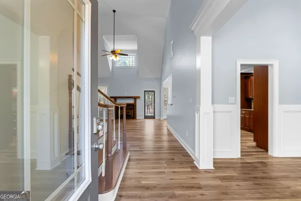a view of a room with wooden floor