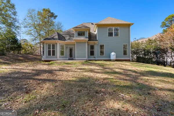 a house that has a big yard in front of it
