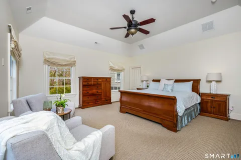 a bed room with a bed and furniture