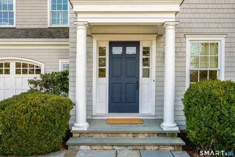 front view of a brick house with a window