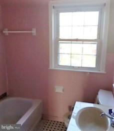 1452 Barrett Road Baltimore, MD 21207 - Photo 14 of 18 a bathroom with a toilet and a sink