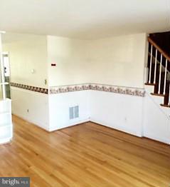 1452 Barrett Road Baltimore, MD 21207 - Photo 4 of 18 a view of a room with wooden floor