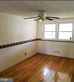 1452 Barrett Road Baltimore, MD 21207 - Photo 5 of 18 a view of an empty room with a window