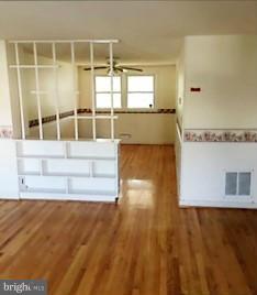 1452 Barrett Road Baltimore, MD 21207 - Photo 6 of 18 a view of a living room with wooden floor
