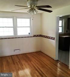 1452 Barrett Road Baltimore, MD 21207 - Photo 7 of 18 a view of an empty room with a window
