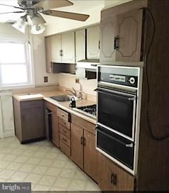 1452 Barrett Road Baltimore, MD 21207 - Photo 9 of 18 a kitchen with appliances cabinets and a sink