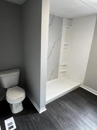 an empty room with a bathroom
