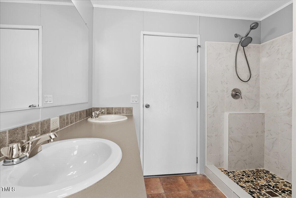 397 Seaman Road Norlina, NC 27563 - Photo 19 of 20 a bathroom with a sink a toilet and shower