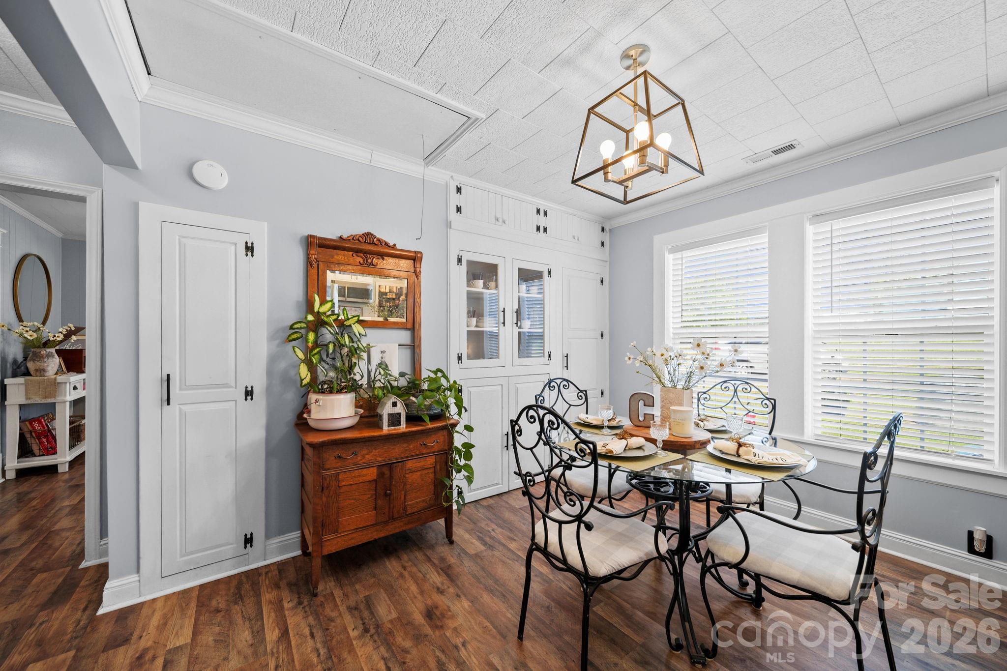 9215 Stokes Ferry Road Salisbury, NC 28146 - Photo 5 of 22 a view of a dining room with furniture window and wooden floor