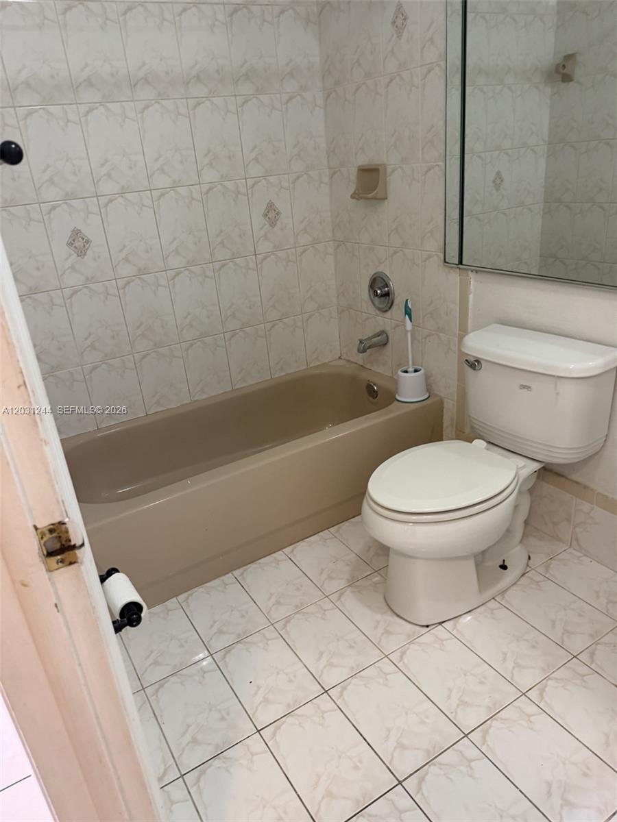 13752 Southwest 156th Street Miami, FL 33177 - Photo 13 of 14 a bathroom with a toilet and a shower