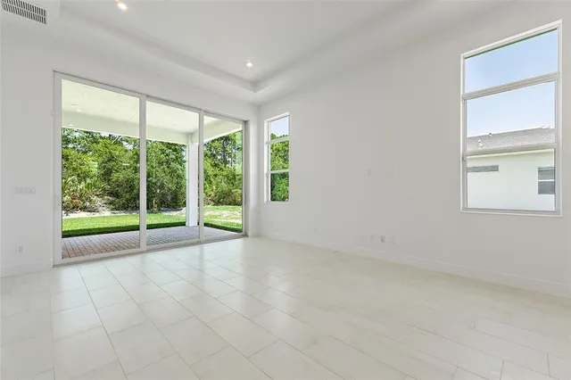 a view of an empty room with a large window