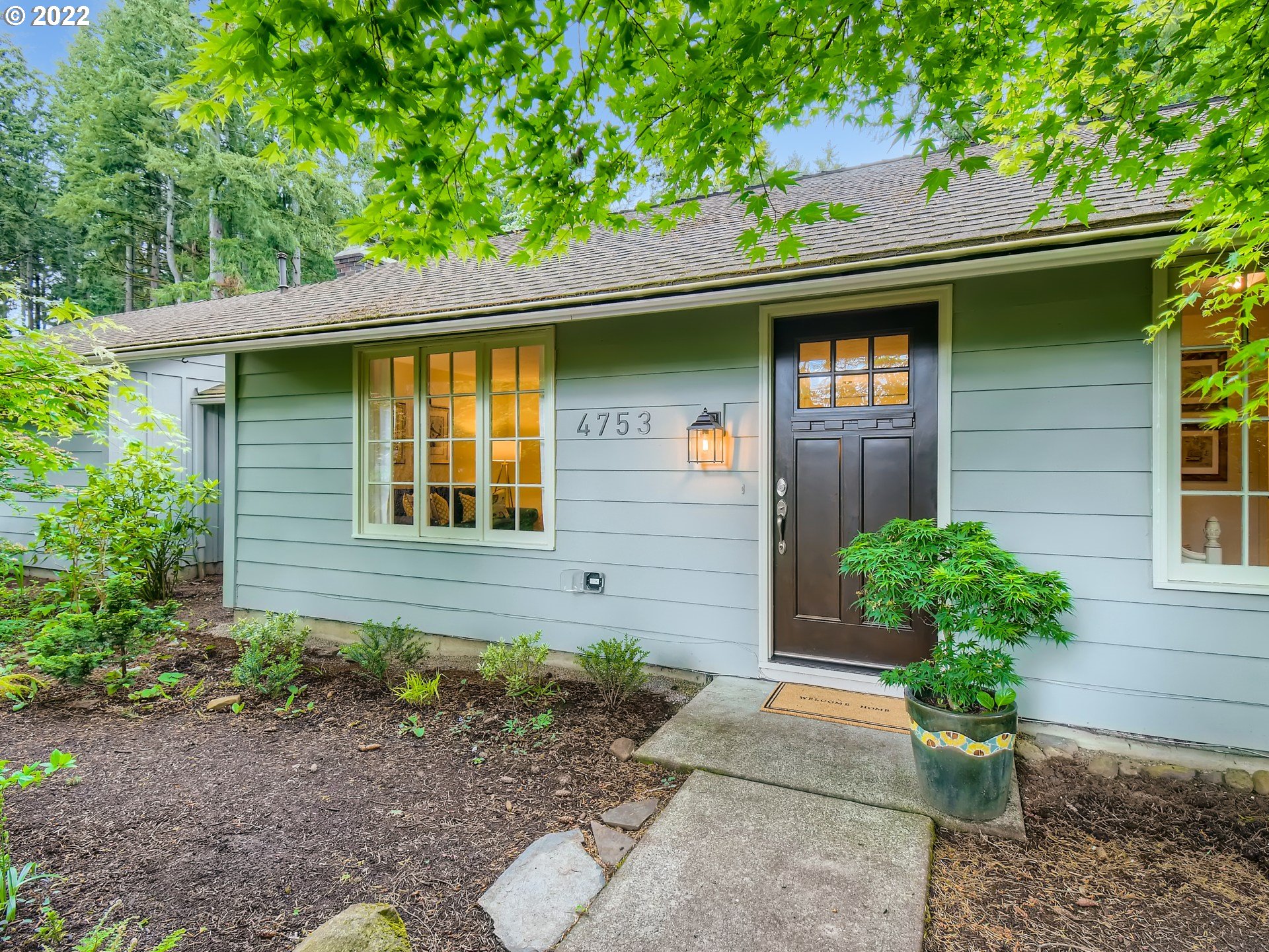 4753 Southwest Dawn Street Lake Oswego, OR 97035 - Photo 1 of 29 a front view of a house with a yard