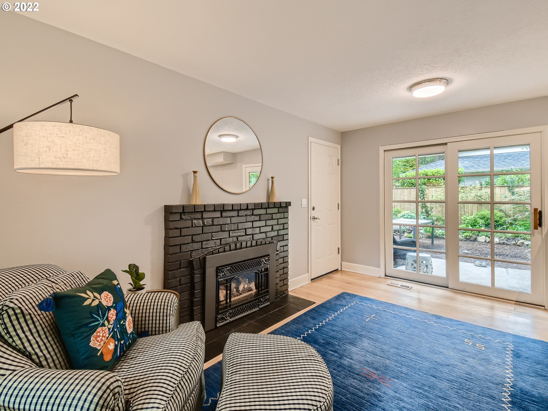 4753 Southwest Dawn Street Lake Oswego, OR 97035 - Photo 14 of 29 a living room with furniture and a fireplace