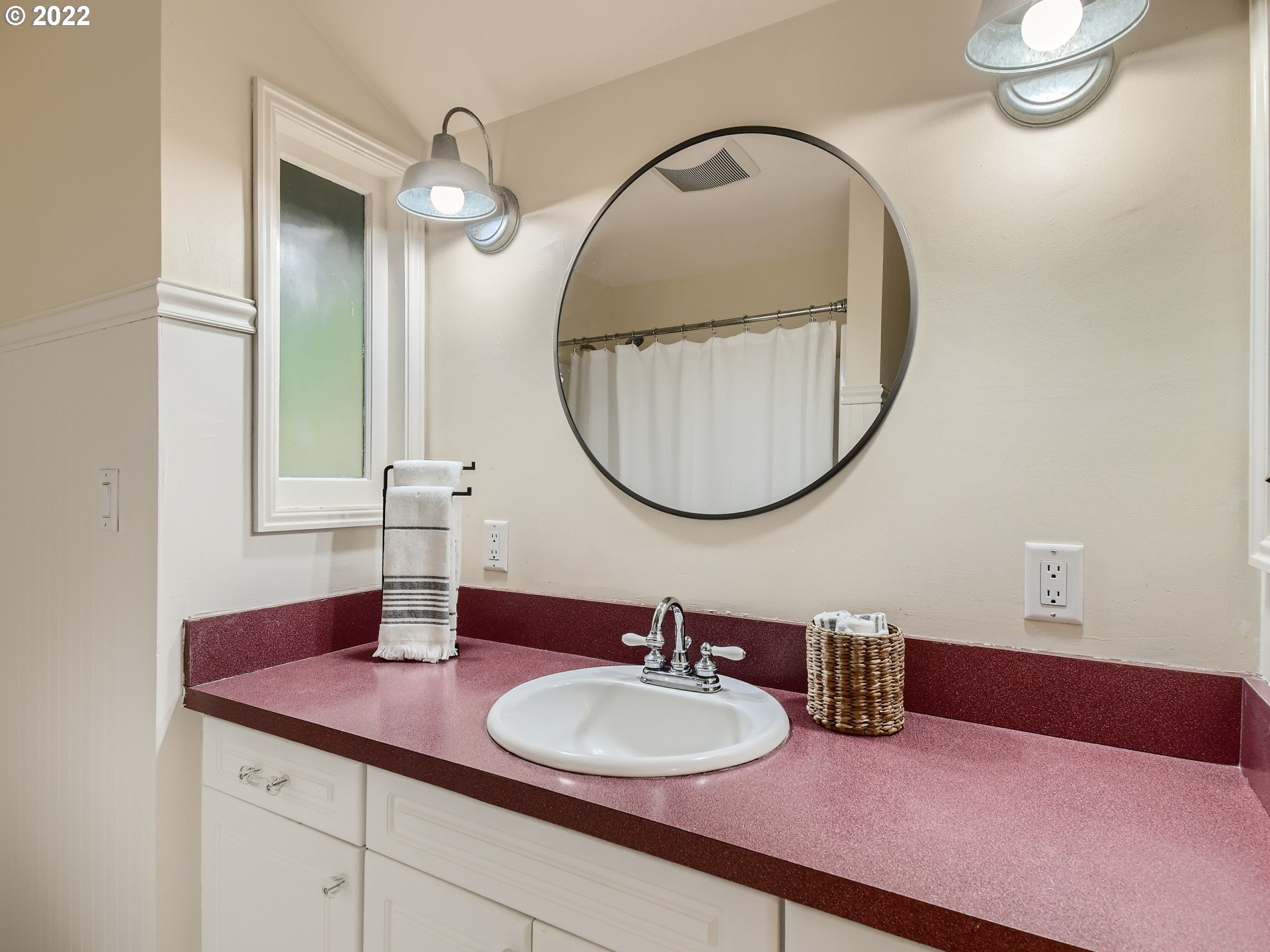 4753 Southwest Dawn Street Lake Oswego, OR 97035 - Photo 18 of 29 a bathroom with a sink and a mirror