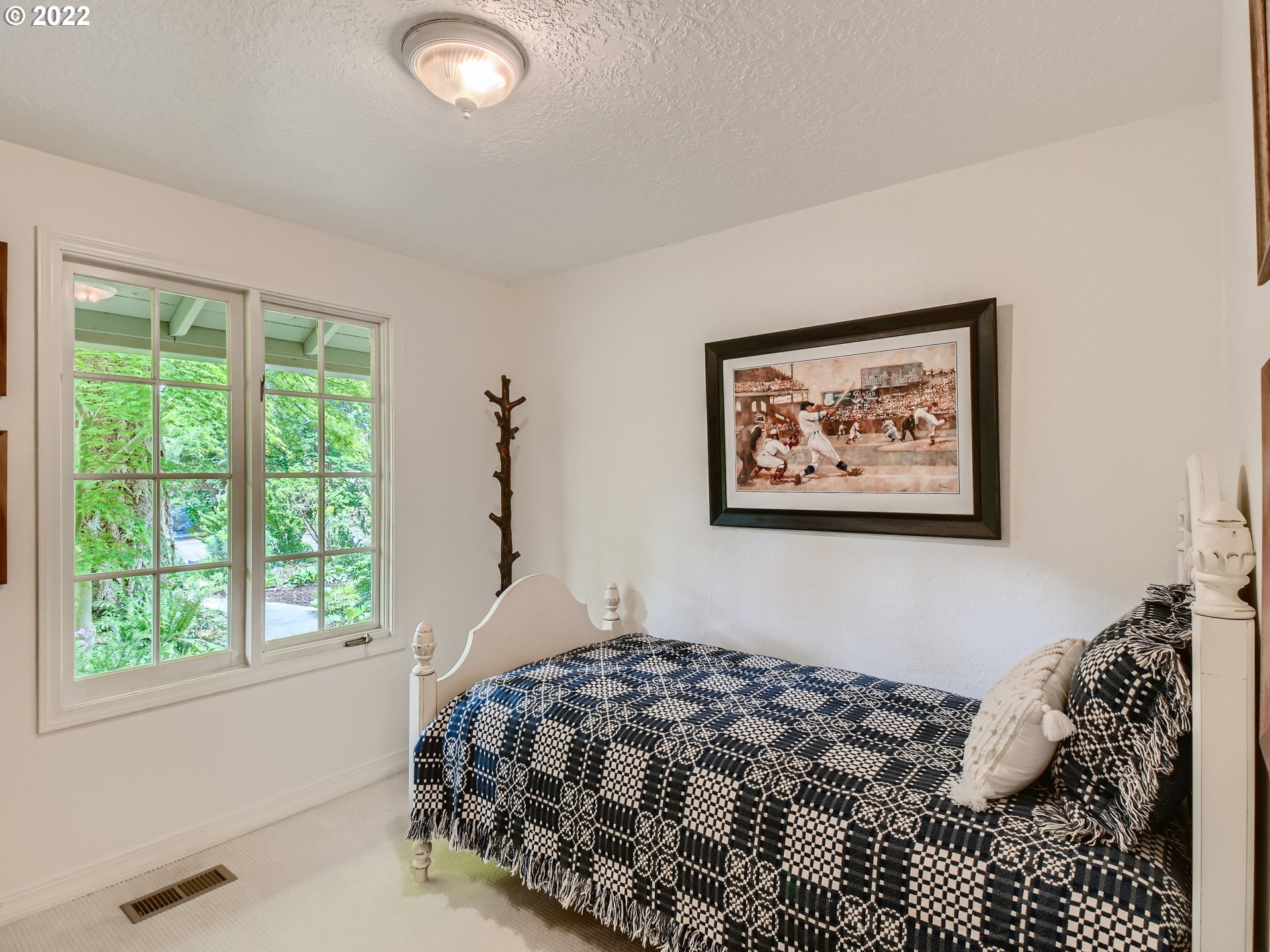4753 Southwest Dawn Street Lake Oswego, OR 97035 - Photo 19 of 29 a bedroom with a bed and a window