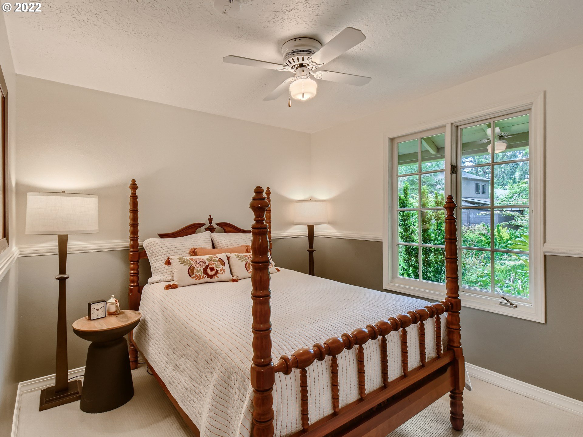 4753 Southwest Dawn Street Lake Oswego, OR 97035 - Photo 21 of 29 a bedroom with a bed and a large window