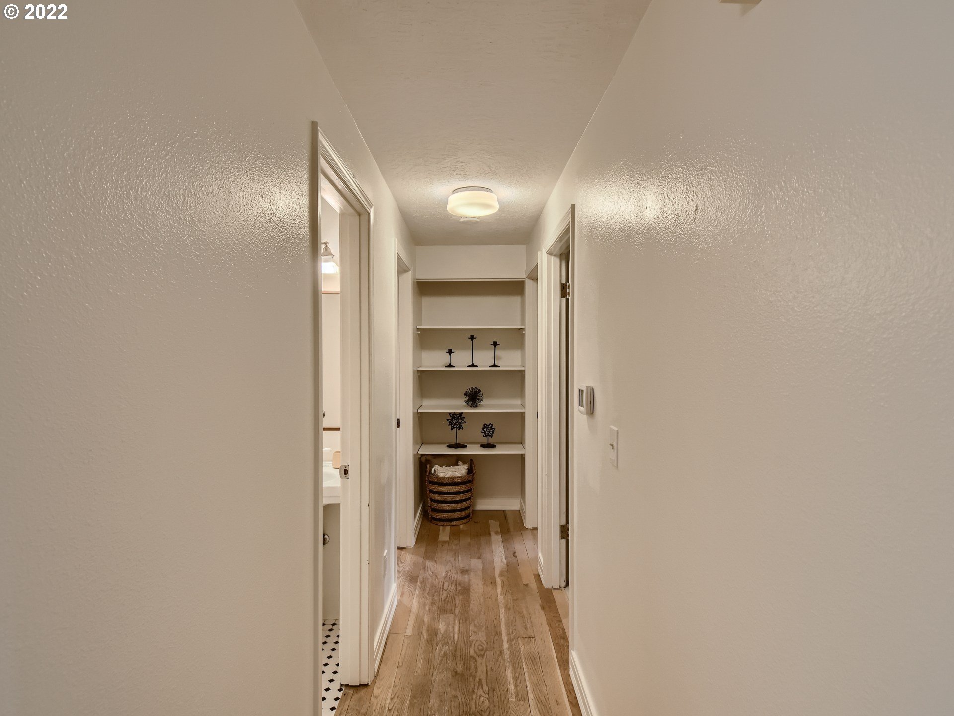 4753 Southwest Dawn Street Lake Oswego, OR 97035 - Photo 23 of 29 a view of a hallway with wooden floor