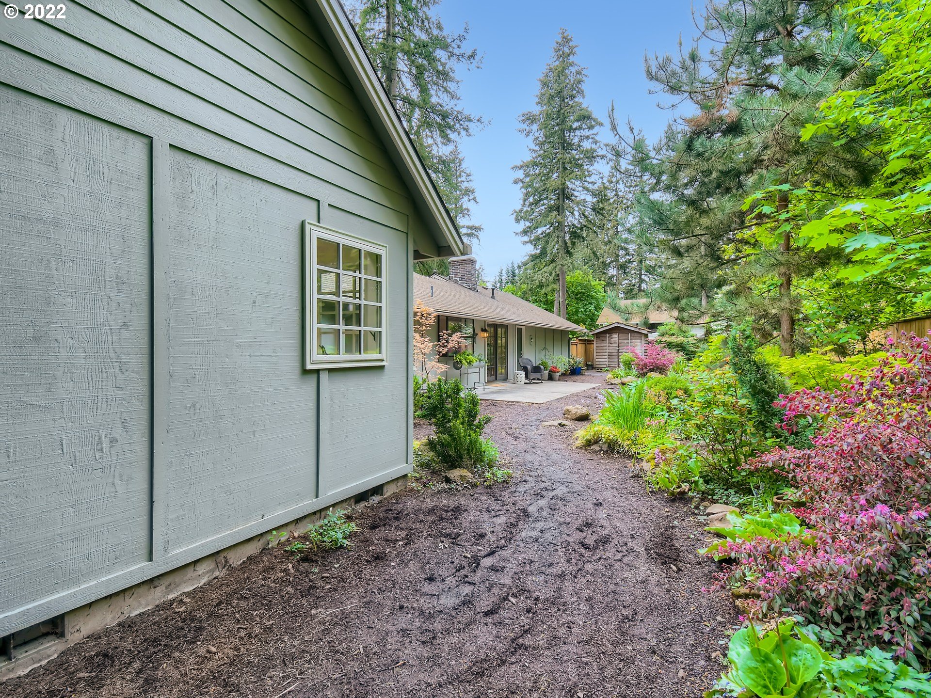 4753 Southwest Dawn Street Lake Oswego, OR 97035 - Photo 25 of 29 a front view of a house with garden