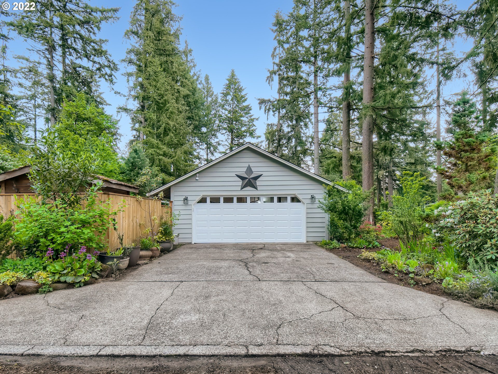 4753 Southwest Dawn Street Lake Oswego, OR 97035 - Photo 28 of 29 a view of a house with a yard and large trees