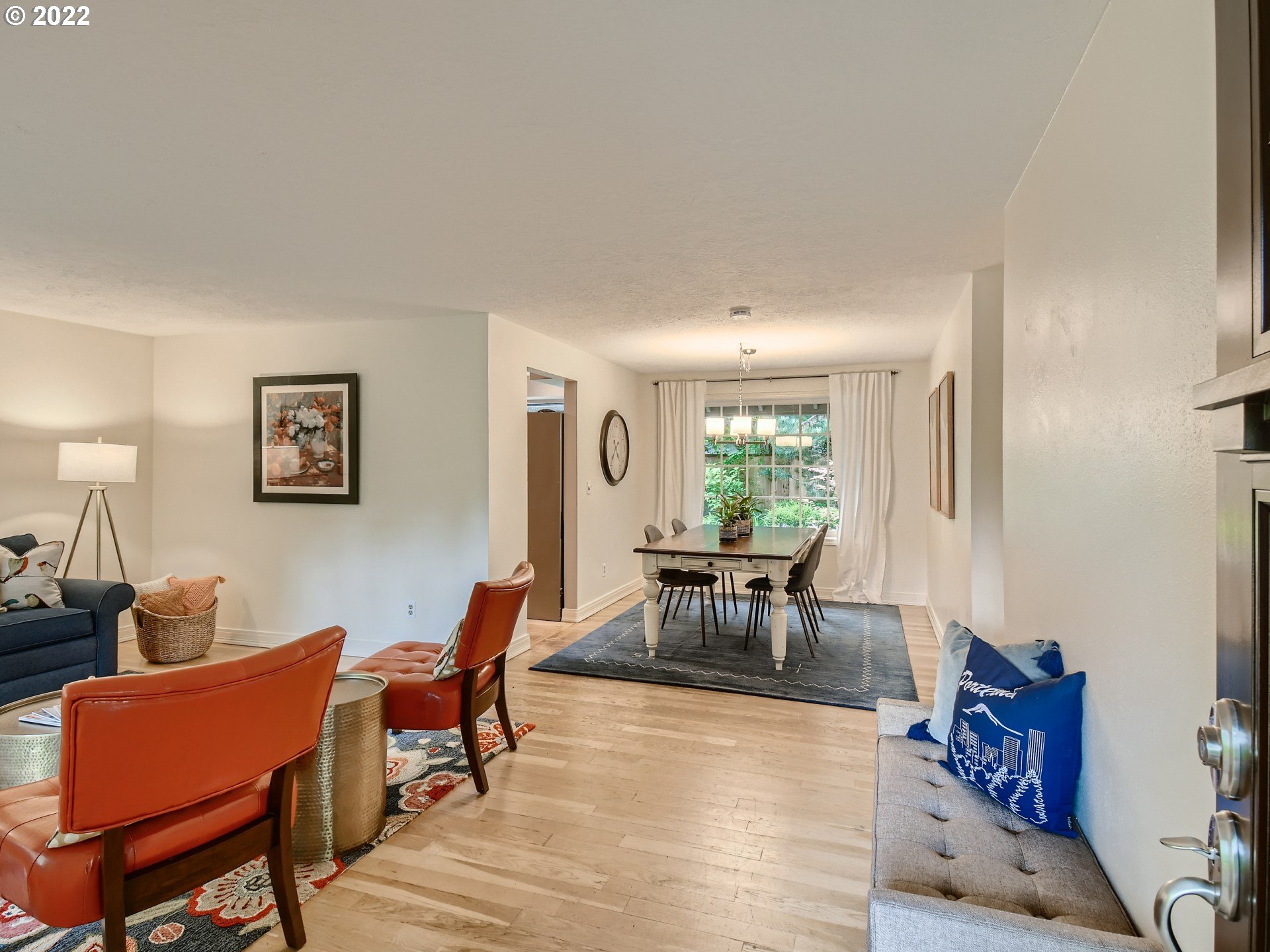 4753 Southwest Dawn Street Lake Oswego, OR 97035 - Photo 4 of 29 a living room with furniture a dining table with wooden floor and a potted plant