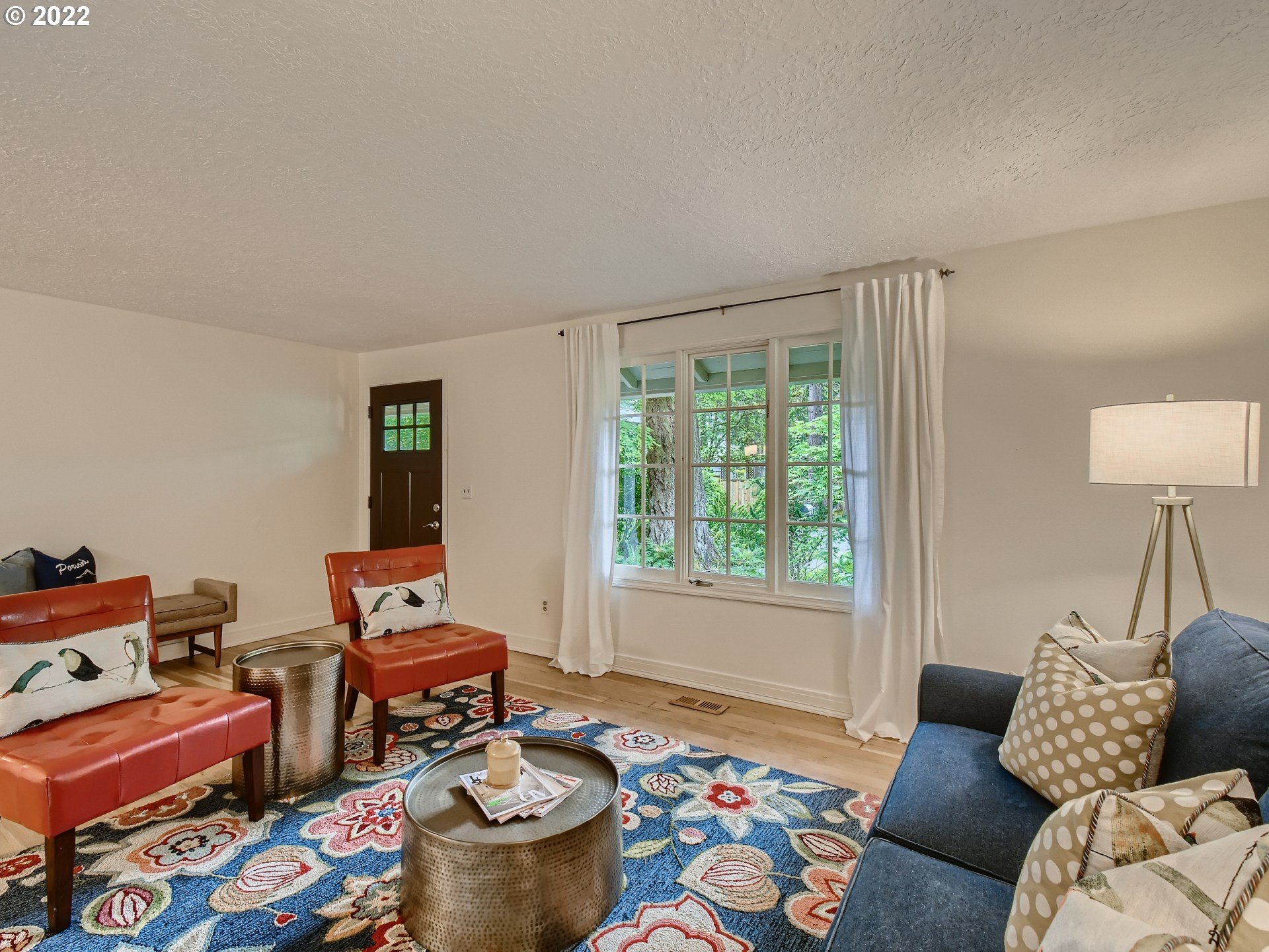 4753 Southwest Dawn Street Lake Oswego, OR 97035 - Photo 6 of 29 a living room with furniture and a window