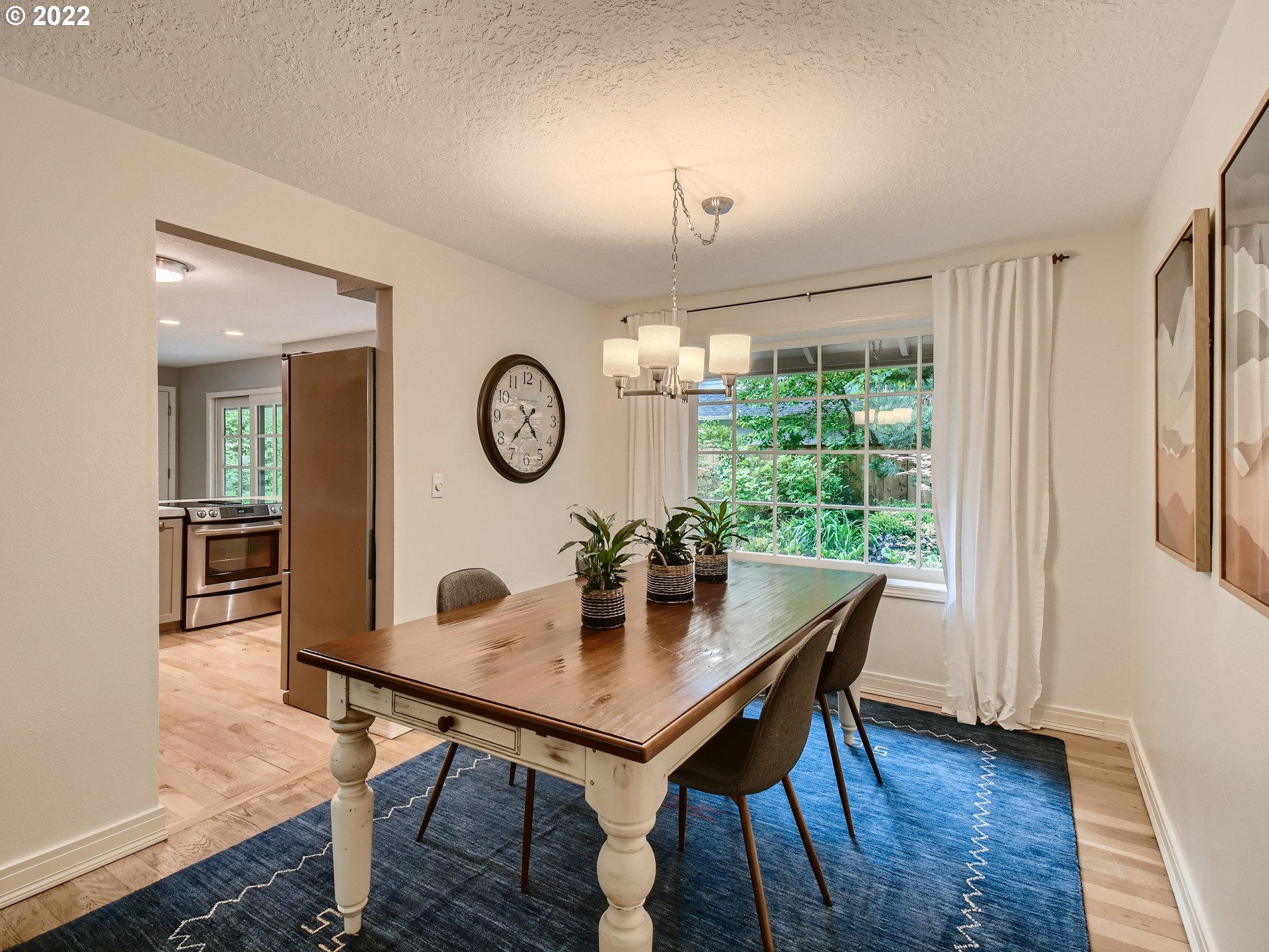 4753 Southwest Dawn Street Lake Oswego, OR 97035 - Photo 7 of 29 a view of a dining room with furniture window and wooden floor