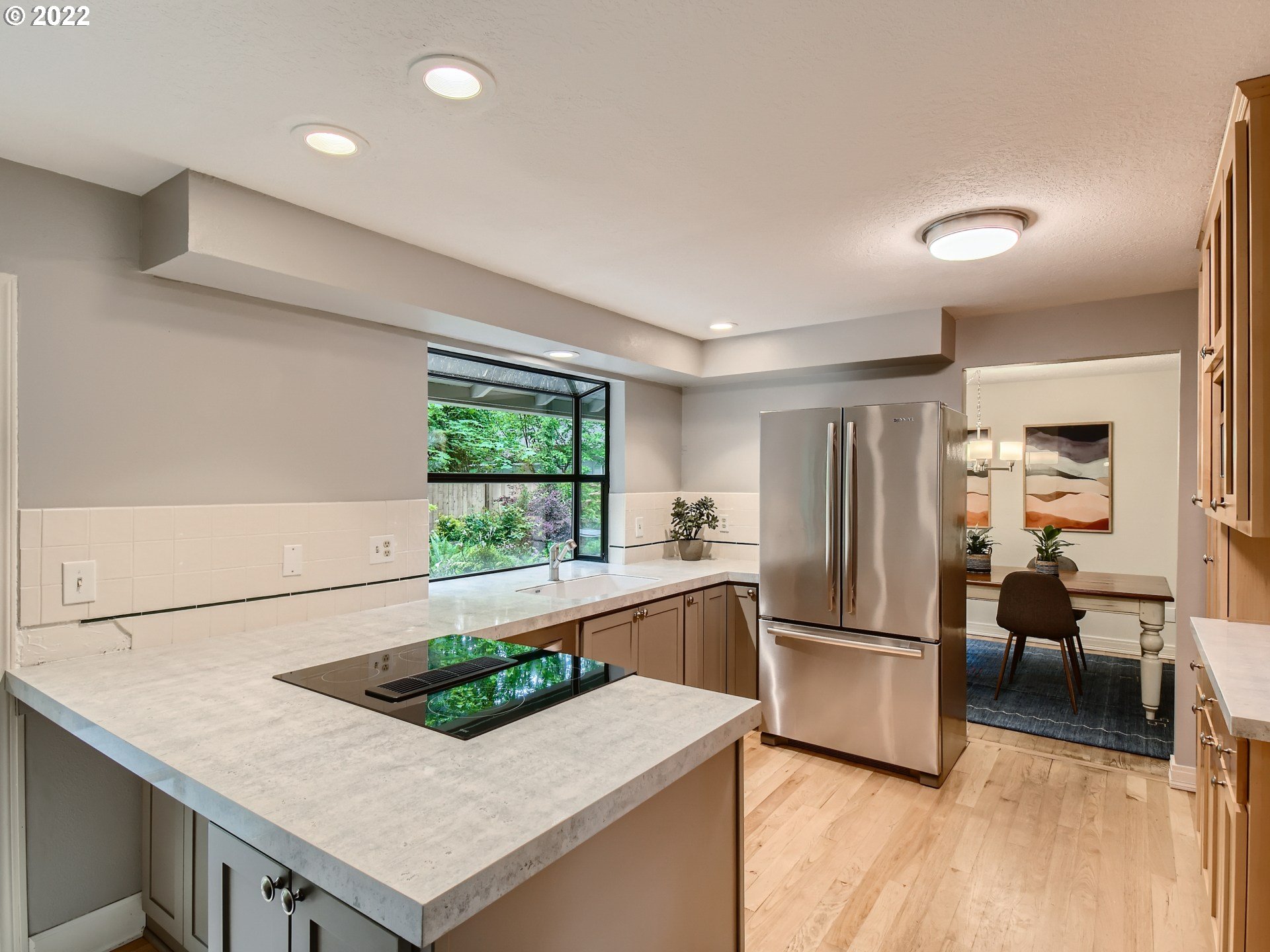 4753 Southwest Dawn Street Lake Oswego, OR 97035 - Photo 9 of 29 a kitchen with stainless steel appliances granite countertop a refrigerator and a sink