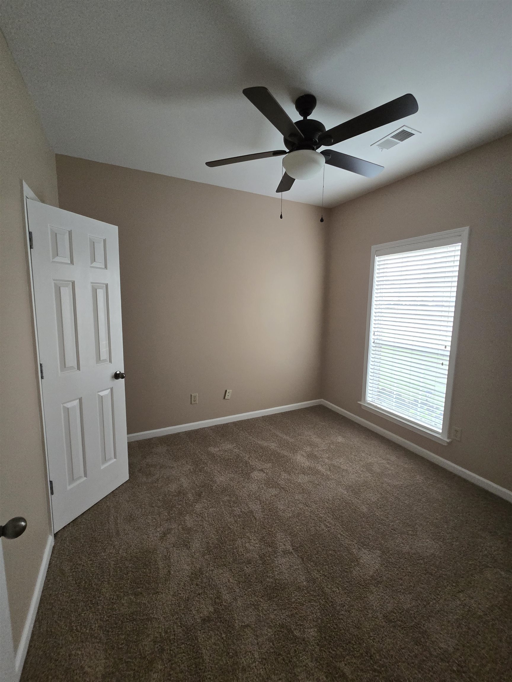 5186 Guffin Road Bartlett, TN 38135 - Photo 13 of 21 Unfurnished room featuring ceiling fan and carpet flooring