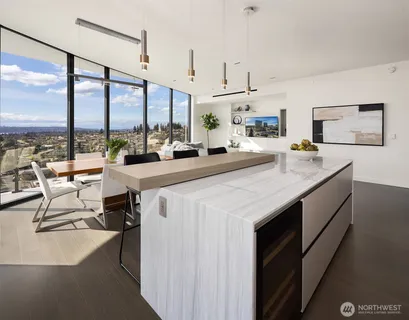 a view of a kitchen with a large window