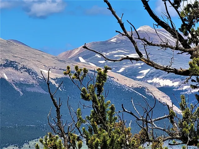 a view of a patio with table and chairs