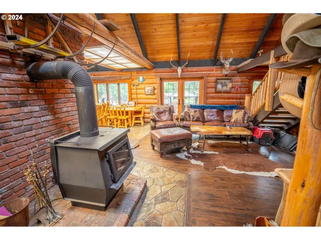 a bathroom with a double vanity sink a mirror and a bathtub