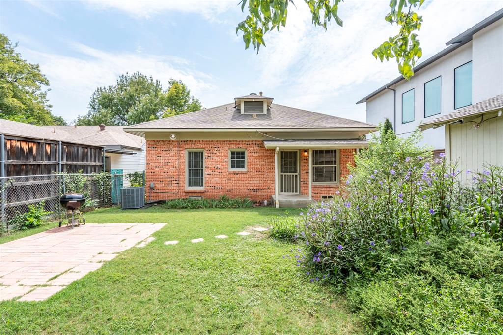 4407 Bonham Street Dallas, TX 75229 - Photo 21 of 22 a front view of a house with a yard