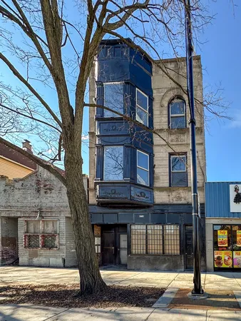 a view of a building with a tree