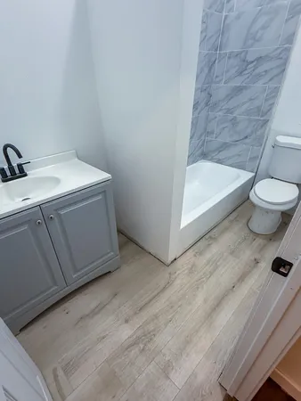a bathroom with a sink and toilet